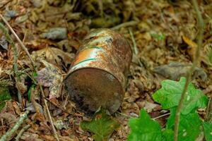 Rusty can in the woods photo