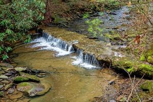 Creek with a waterfall photo