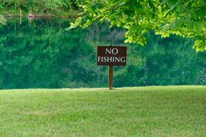 No fishing sign at the lake photo
