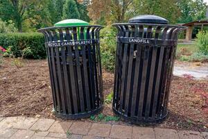 Recycle and garbage cans in the park photo