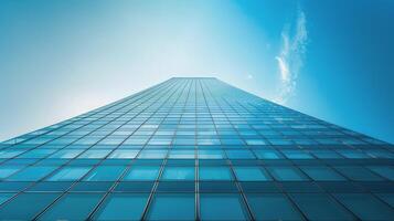 Tall Building With Lots of Windows Against a Blue Sky photo