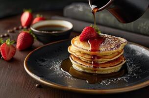 Stack of Pancakes With Syrup and Strawberries on a Plate photo