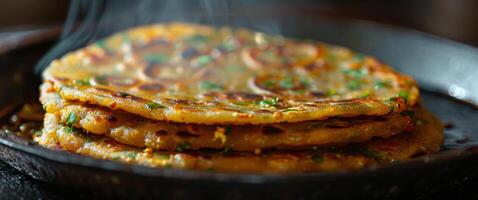 Stack of Fried Flatbreads With Smoke on Pan photo