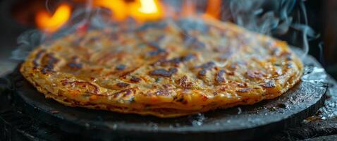 Stack of Fried Flatbreads With Smoke on Pan photo