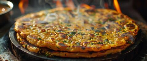 Stack of Fried Flatbreads With Smoke on Pan photo