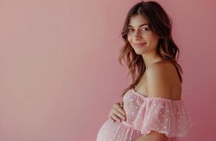 Pregnant Woman Posing in Pink Dress photo