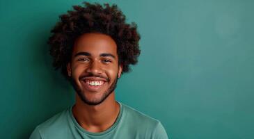 Smiling Black Man With Dreadlocks on Green Background photo