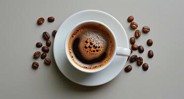 A Cup of Coffee Surrounded by Coffee Beans photo
