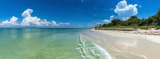 A View of a Beach With Water and Clouds photo