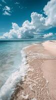 A View of a Beach With Water and Clouds photo