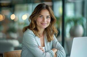 Woman Sitting at Desk With Laptop photo