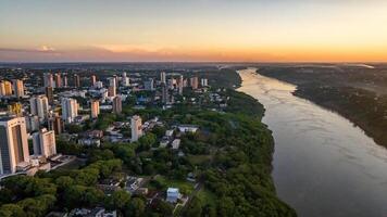 Border between Brazil and Paraguay and connects Foz do Iguacu to Ciudad del Este. Ponte da Amizade in Foz do Iguacu. Aerial view of the Friendship Bridge with Parana river. photo