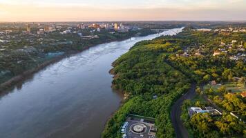 Border between Brazil and Paraguay and connects Foz do Iguacu to Ciudad del Este. Ponte da Amizade in Foz do Iguacu. Aerial view of the Friendship Bridge with Parana river. photo