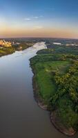 Border between Brazil and Paraguay and connects Foz do Iguacu to Ciudad del Este. Ponte da Amizade in Foz do Iguacu. Aerial view of the Friendship Bridge with Parana river. photo