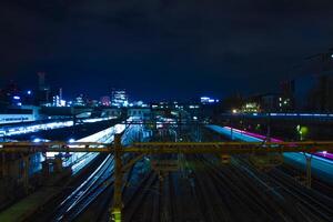 A train at Ueno station at night wide shot long exposure photo