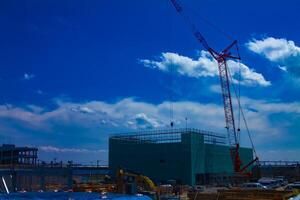 Cranes at the under construction in Tokyo wide shot photo