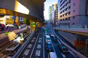 An urban city street in Shibuya Tokyo daytime wide shot photo