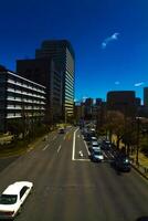 A cherry street at Yasukuni avenue in Tokyo wide shot photo