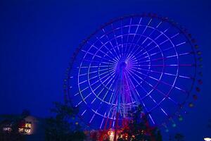 A dusk ferris wheel at the amusement park in Odaiba Tokyo photo