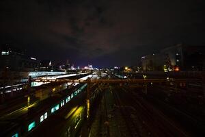 A train at Ueno station at night wide shot long exposure photo