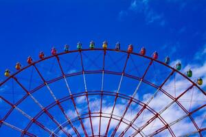 A ferris wheel at the amusement park in Odaiba Tokyo daytime long shot photo