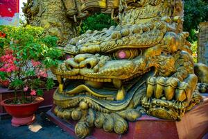 A Big Statue Guardian dog at Suoi Tien park in Ho Chi Minh wide shot photo