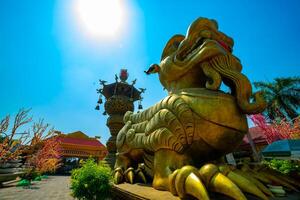 A Big Statue Guardian dog at Suoi Tien park in Ho Chi Minh wide shot photo