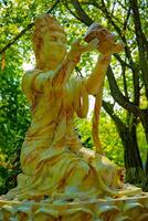 A Guardian statue at Suoi Tien park in Ho Chi Minh Vietnam photo