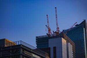 Crane at the under construction behind the blue sky in Tokyo photo