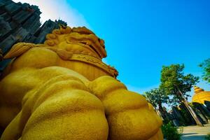 A Big Statue Guardian dog at Suoi Tien park in Ho Chi Minh low angle photo