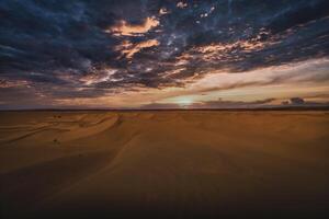 A dusk of panoramic sand dune at Mhamid el Ghizlane in Morocco wide shot photo
