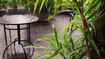 Garden table in the middle of the rain. photo