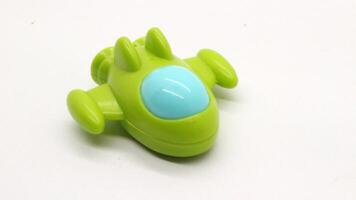 Children's toy, shaped like a plane in green photo