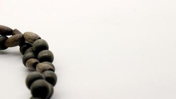 Close up of round wooden necklace isolated photo