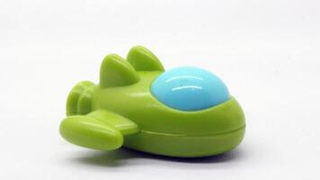 Children's toy, shaped like a plane in green photo