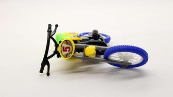 Yellow dirt bike toy isolated photo