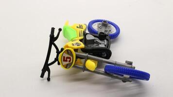 Yellow dirt bike toy isolated photo