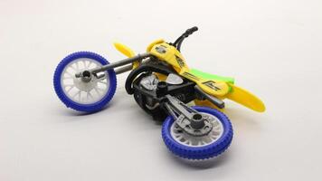 Yellow dirt bike toy isolated photo