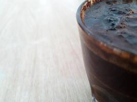 Close up view of Black coffee in glass photo