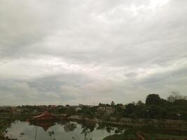 View of the sky with bright clouds on the lake photo