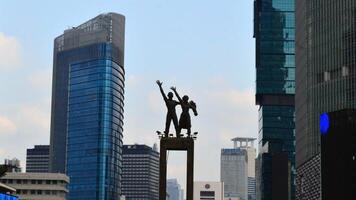 View of the city of Jakarta from a height monument selamat datang photo