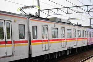 Commuter Line or electric train in Jakarta, Indonesia. photo