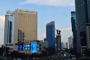 View of the city of Jakarta from a height monument selamat datang photo