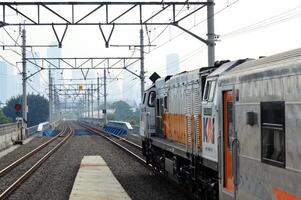 Commuter Line or electric train in Jakarta, Indonesia photo