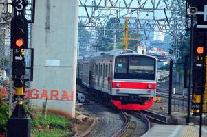 Commuter Line or electric train in Jakarta, Indonesia. photo