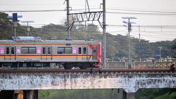 Commuter Line or electric train in Jakarta, Indonesia. photo