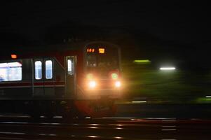 Commuter Line or electric train in Jakarta, Indonesia. photo