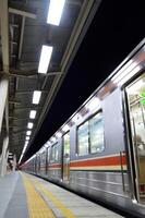 Commuter Line or electric train in Jakarta, Indonesia. photo