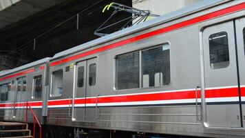 Commuter Line or electric train in Jakarta, Indonesia. photo