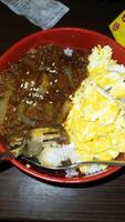 Fried rice and rice bowls on dining table photo